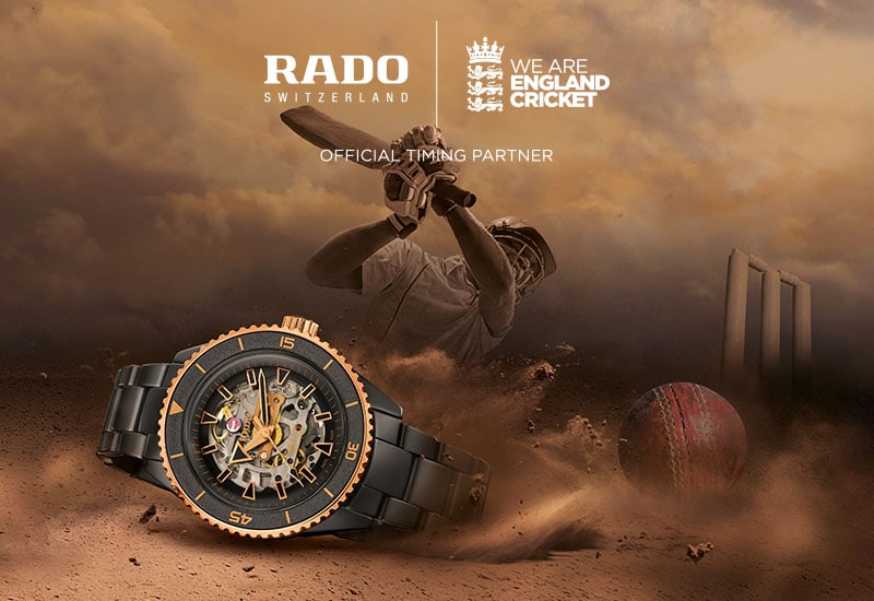 2 men and 1 women England cricketers standing with arms folded facing the camera wearing blue uniiforms, with black and white portrait close ups shown above them